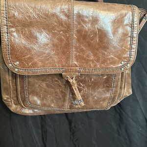 Brown leather the Sak satchel/backpack.